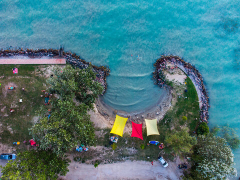 Hidden Cove on Lake Balaton with Colorful Sun Shades &ndash; Aerial Drone View