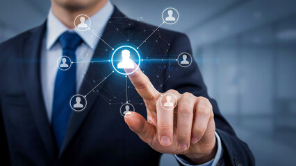 Obraz premium Digital Network Selection: A businessman in a suit touches a glowing digital interface, connecting to a network of user icons, symbolizing selection and connection in the digital age.