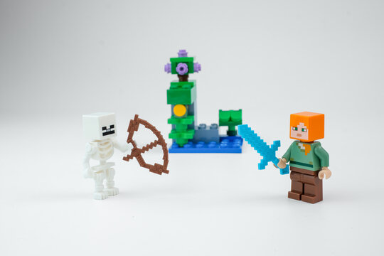 Minecraft-style toy figures show a skeleton with a bow facing a block character holding a blue sword beside a fantasy toy structure on Apr 13, 2026 in Jakarta, Indonesia