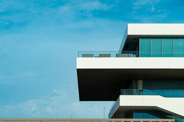 Modern Mediterranean architecture. White building with large windows. Blue sky and copy space © Inspiraciones