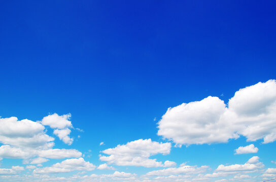 blue sky background with tiny clouds
