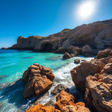 Turquoise seawater laps gently against rugged rock formations beneath a brilliant blue sky, reflecting sun's warmth, natural, ocean