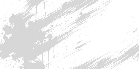 Obraz premium Abstract grey paint splatters and brush strokes on white background with copy space for design