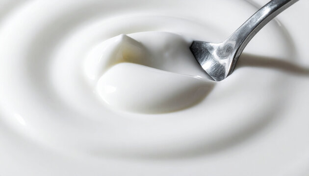 Extreme macro yogurt with spoon indentation and shadow texture detail