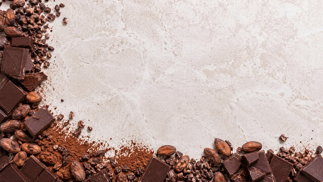 Dark Chocolate Cacao Beans Nibs and Cocoa Powder Border on Light Stone Background