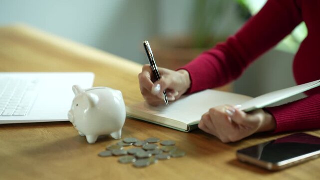 Person stacking coins beside a piggy bank, illustrating personal savings, budgeting, financial planning, and smart money management.