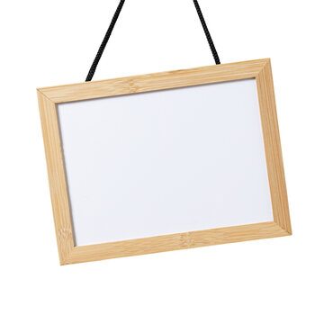 Blank whiteboard with wooden frame hanging cut out