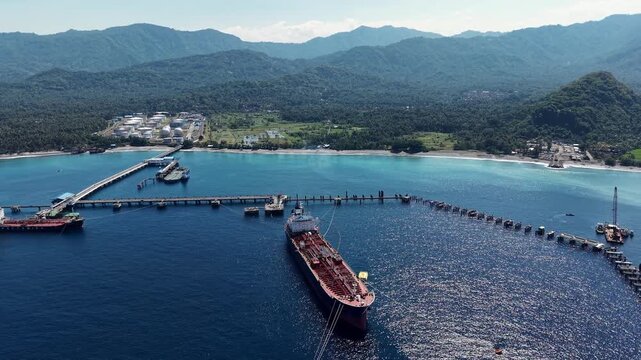 Candidasa, Bali, Indonesia - July 17, 2026: Aerial view of Pertamina oil tanker moored at marine terminal jetty.