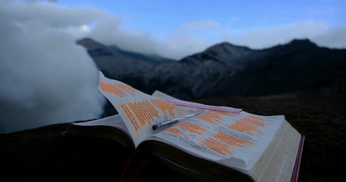 Open Bible on Active Volcano at Mount Bromo, Indonesia