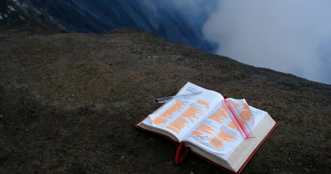 Wide shot of a Open Bible on Active Volcano at Mount Bromo, Indonesia