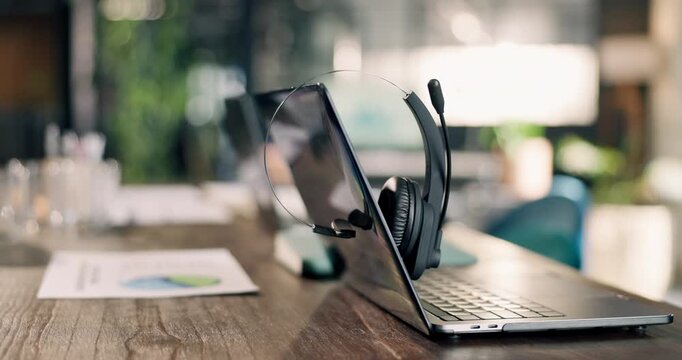 Empty, office and laptop with headset in call center for financial consulting, trading advice or investment. Documents, background and computer with mic for contact us, loan support or finance agency