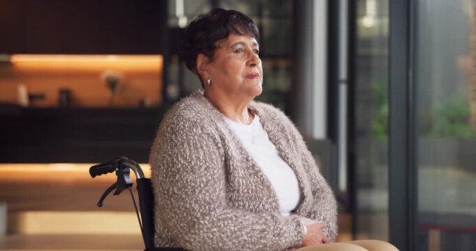 Wheelchair, thinking and senior woman by window with deep thoughts, memory or remember past. Retirement, reflection and serious person with disability at home for view, introspection or flashback