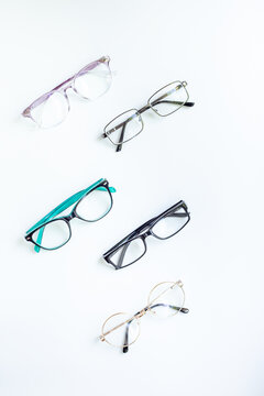 Glasses for vision on a white background in optical store. Vision test concept, stylish glasses concept