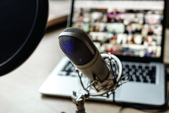 Radio broadcasting studio with podcast equipment: microphone and laptop