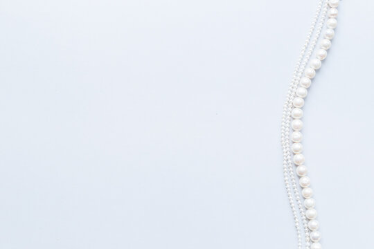 Natural white baroque round pearls - beads for jewelry, top view. Gemstones background