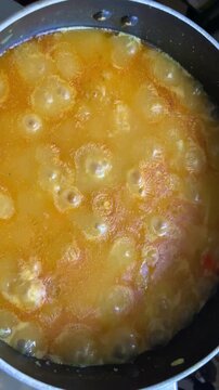 Vegetable hotchpotch bubbling in a cooking pot as it nears completion in a home kitchen in Dhaka, Bangladesh. Traditional homemade meal simmering with rich flavors.