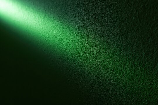 The Green Textured Surface Bathed in Dramatic Diagonal Light and Shadow Play