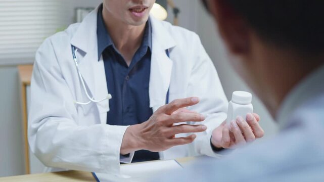 Doctor explaining treatment and medication instructions to a patient during a medical consultation in a clinic office, representing patient care, prescription guidance, healthcare service and treatmen