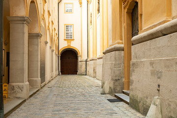 Fototapeta premium Baroque architecture elements with columns and stone walls in old European monastery