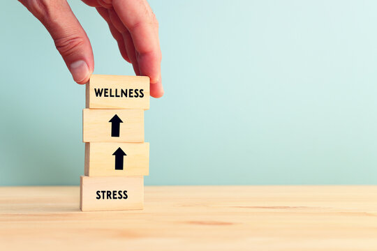 Wooden cubes with text, wellness or stress concept