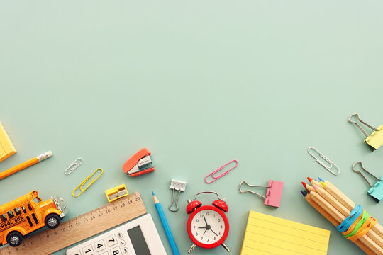 Back to school concept over pastel background. Top view