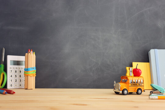 Back to school concept over classroom blackboard. Top view