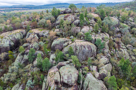 Aerial view of the dramatic granite rock formations and natural landscape at Cranky Rock Nature Reserve near Warialda, NSW. Surrounded by bushland