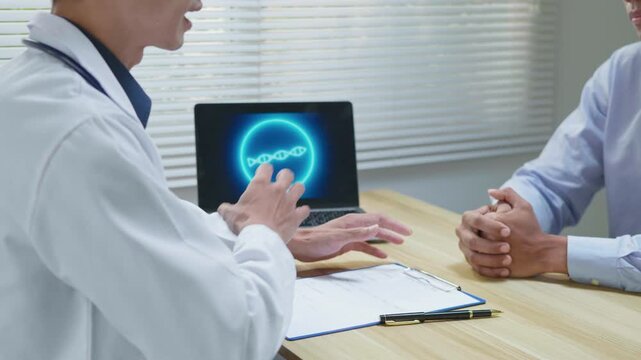 Doctor taking a patient&rsquo;s medical history and explaining treatment options during a clinic consultation, using a laptop with medical data to support diagnosis, patient care and healthcare planning.