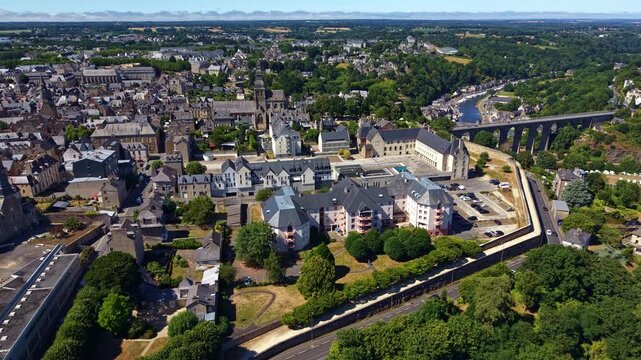 Historic center of Dinan, Cotes-d'Armor, Brittany, France, featuring Saint-Sauveur Basilica, Dinan Viaduct and the Rance River valley, medieval architecture and fortified townscape, lateral slide