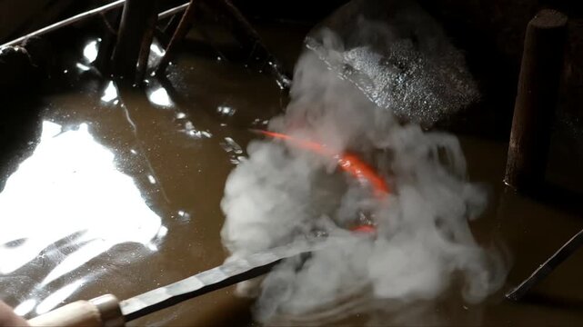 Professional metalworking involves heating sickle blades in a coal furnace followed by quenching in liquid and sharpening on a grinding wheel to ensure a finished tool ready for agricultural utility