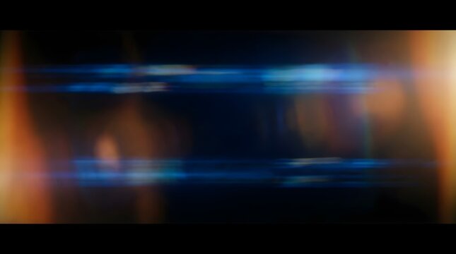 Abstract Blue and Orange Anamorphic Lens Flare Effect on Dark Background