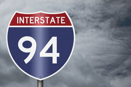 American Interstate I94 sign with stormy sky for transportation