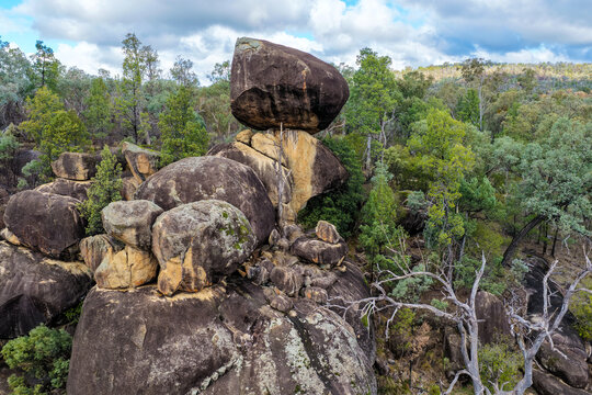 Aerial view of the dramatic granite rock formations and natural landscape at Cranky Rock Nature Reserve near Warialda, NSW. Surrounded by native bushland
