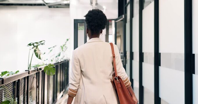 Business, walking and black woman with bag in office building for work arrival or start in workplace. Back view, female person or employee with entrance or door for punctuality or time management