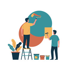 Fototapeta premium Two men painting geometric mural shapes on an interior wall.