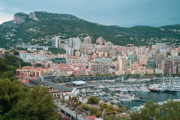 Obraz premium Exclusive real estate development and luxury hillside residential apartments overlooking Port Hercules in Monte Carlo, Monaco