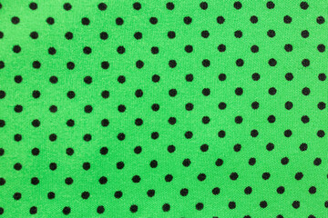 Green polka dot fabric texture background pattern © Iryna Miadzvedzeva