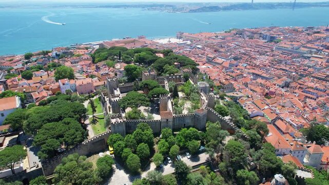 Flying towards S&atilde;o Jorge Castle with the Tagus River as a backdrop and the camera focused on the castle,Lisbon,Portugal