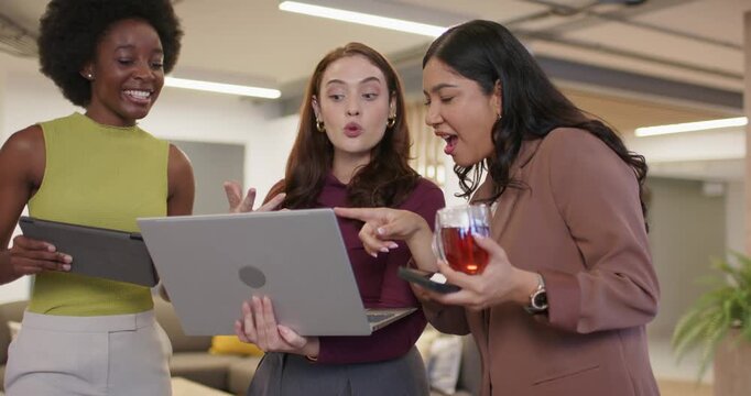 Diverse female team watching center woman presenting laptop, sharing idea and reacting at office