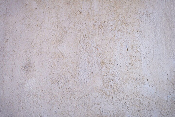 Fototapeta premium Light beige plaster wall texture with subtle rough surface and natural cement variations. Clean material ideal for architectural backgrounds, interior walls, construction, and seamless design textures