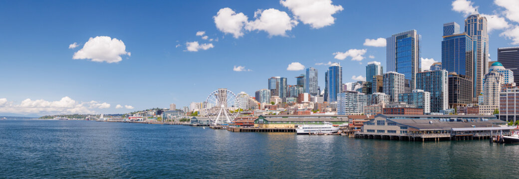 Bright and sunny panoramic view of Seattle skyline from the water