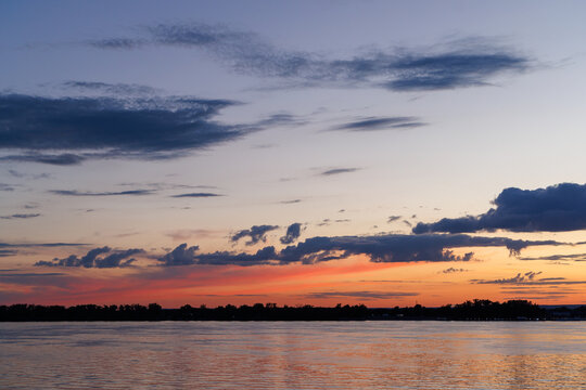 Dramatic twilight sky over river horizon