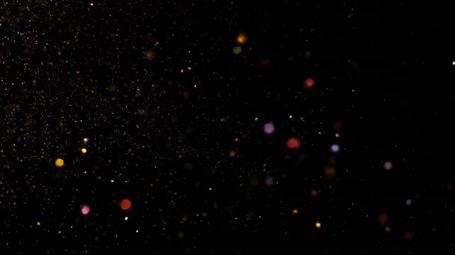 glowing particles floating in dark space animation
