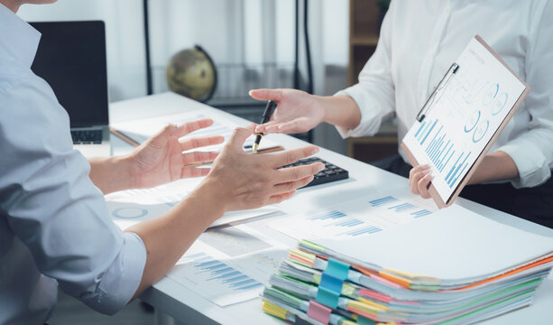 economic concepts Business and partner plan data analysis to determine the direction of the company's business investment in the workplace. Night Marketing Consultant Concept