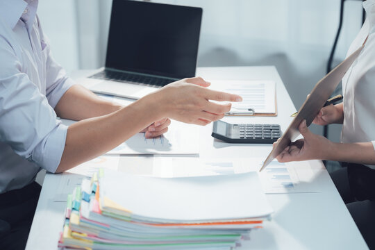 economic concepts Business and partner plan data analysis to determine the direction of the company's business investment in the workplace. Night Marketing Consultant Concept