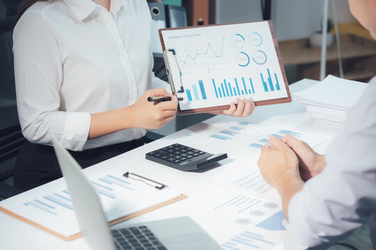 economic concepts Business and partner plan data analysis to determine the direction of the company's business investment in the workplace. Night Marketing Consultant Concept
