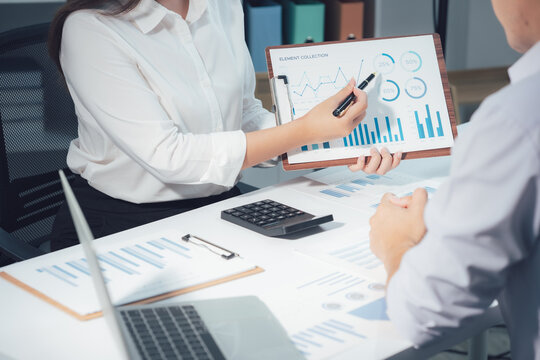 economic concepts Business and partner plan data analysis to determine the direction of the company's business investment in the workplace. Night Marketing Consultant Concept