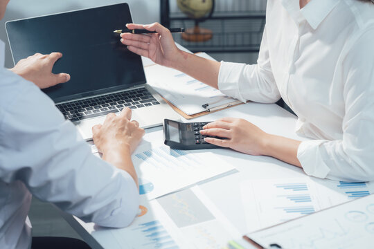 economic concepts Business and partner plan data analysis to determine the direction of the company's business investment in the workplace. Night Marketing Consultant Concept