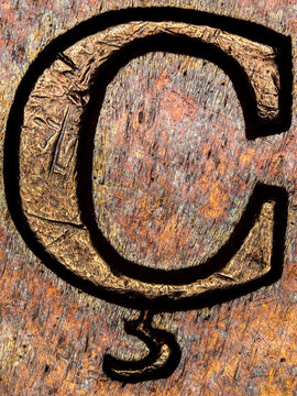 Letter &Ccedil; engraved on a 1974 French 50 francs coin under microscope