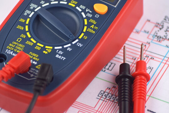 The digital multimeter electrical engineering drawings, circuit breaker and pencils